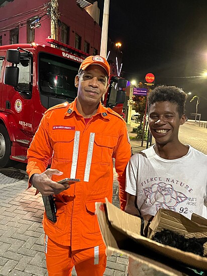 Gabriel and the firefighter who helped with the rescue.