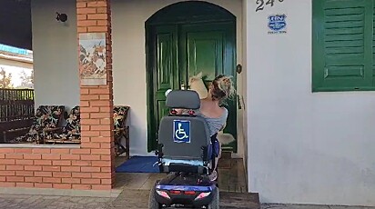 Nathan opens the door for his owner. 