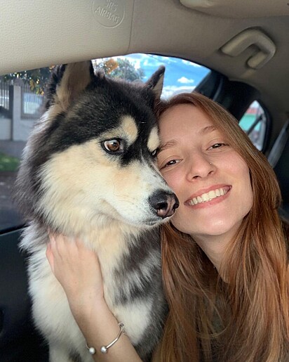 Eduarda loves her little dog so much.