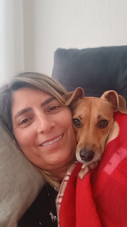 Cristiane loves this little dog so much.
