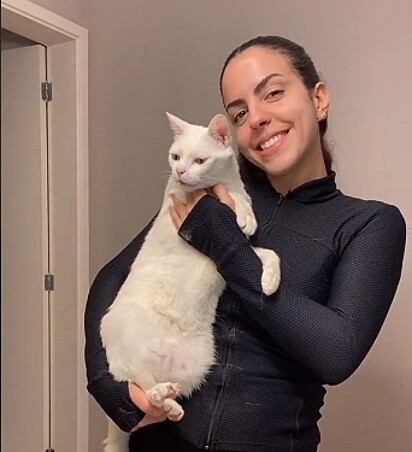 Carol next to her cat, Fred.