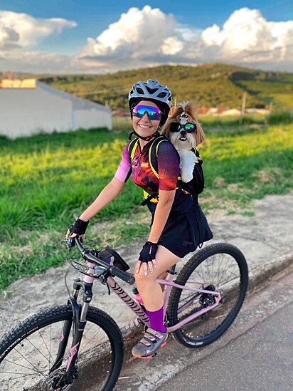 Nick the dog loves to cycle with his owner.